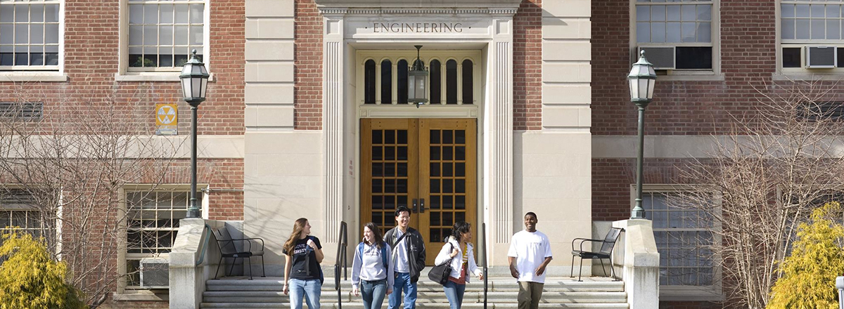 Exterior photo of Marston Hall with student walking in front