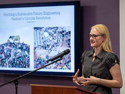 Award recipient Vivian Schutt ’26 explains her project, “Stitching a Sustainable Future: Engineering Fashion’s Circular Revolution.