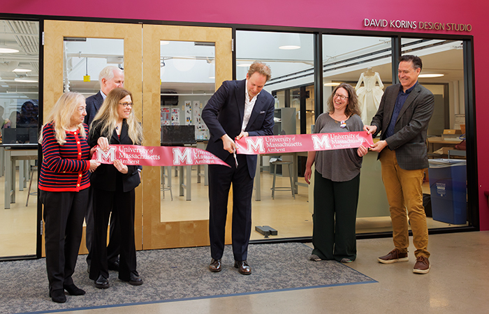 UMass parents Sara and Doug Bailey P’03, from left; their daughter, Laura Bailey ’03; David Korins ’99; Department of Theater Chair Amy Altadonna; and Executive Director of Development Robby O’Sullivan celebrate the dedication of the David Korins Design Studio, a new makerspace that will inspire future generations of UMass Amherst theater students.