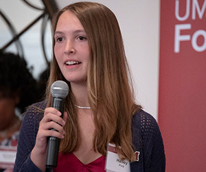 Scholarship recipient Hailey Fink '28 speaks at the 2024 Cape Cod Alumni Network Seaside Celebration