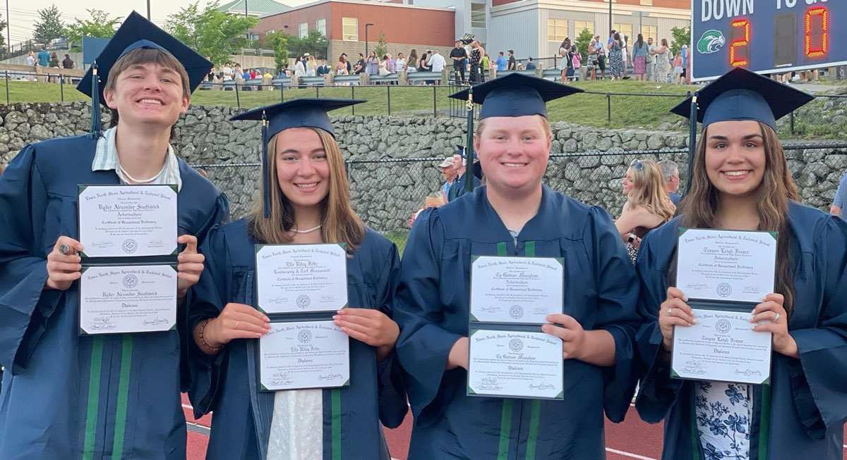 Ty Moughan with friends who went on to attend UMass Amherst at their graduation from Essex North Shore Agricultural & Technical School.