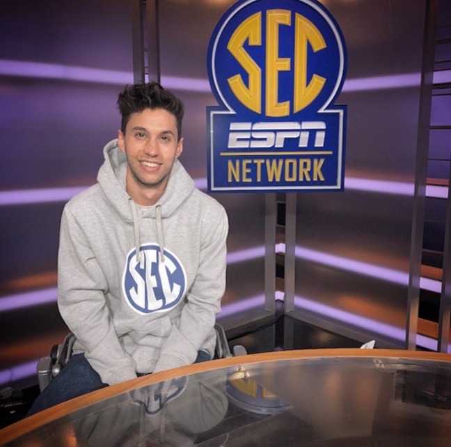 Jeremy Bhandari ’18 sits at ESPN’s SEC Network desk, located in Charlotte, N.C.