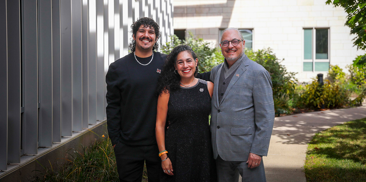 Deans Honors Scholarship 2025 FINAL.jpg: From left, Miguel Angel Paredes ’17 and his parents, Commonwealth Honors College Dean (CHC) Mari Castañeda and Architecture Professor Joseph Krupczynski ’01MS, recently endowed the Castañeda, Paredes, Krupczynski (CPK) Family Scholarship Endowment to support first-generation Honors College students.