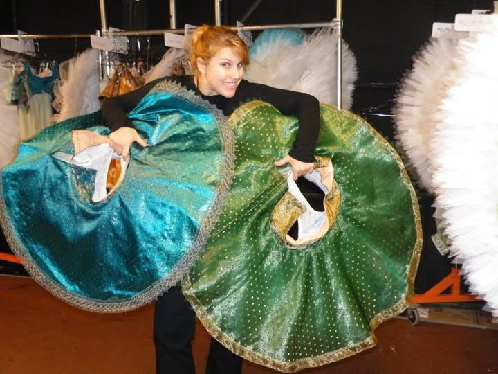 Jillian Clark backstage at the Boston Opera House holding two tutus she built for the Boston Ballet “La Bayadere.” 