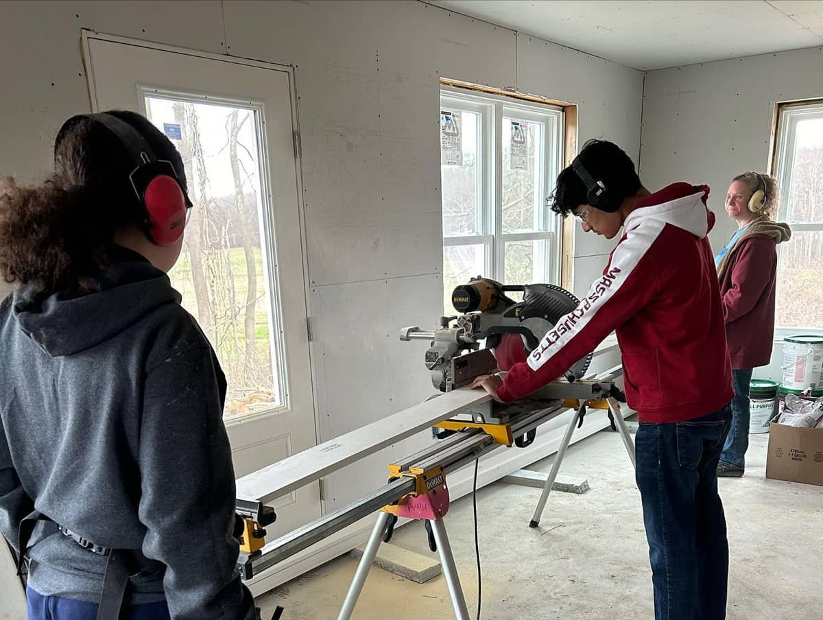 Students from UMass’s chapter of Habitat for Humanity building homes for those in need.